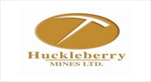 A gold and white logo for huckleberry mines ltd.